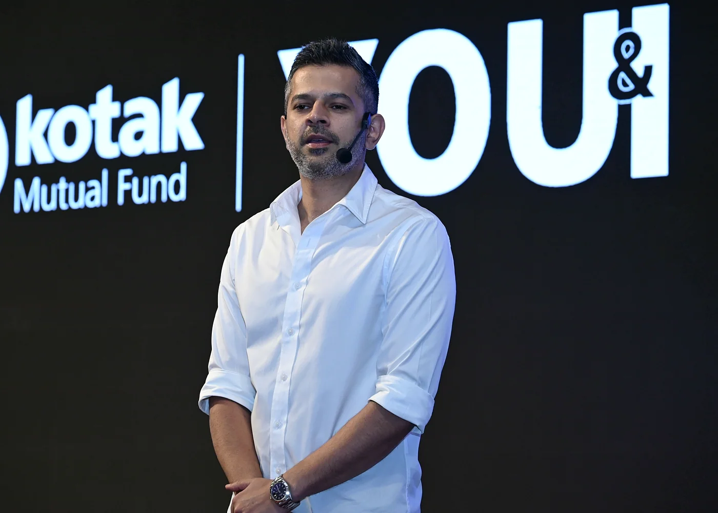 Atul Yadav on stage at a Kotak event